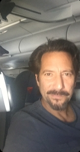 Ian on the plane going home from Atlanta Nov. 2019 .jpg